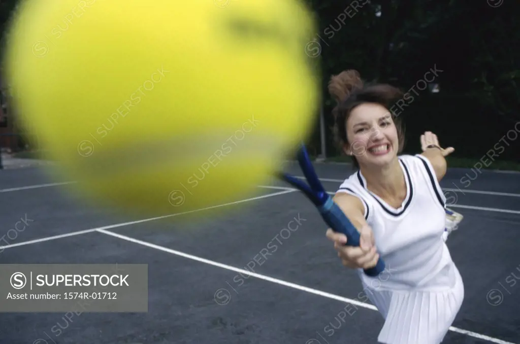 Close-up of a young woman playing tennis