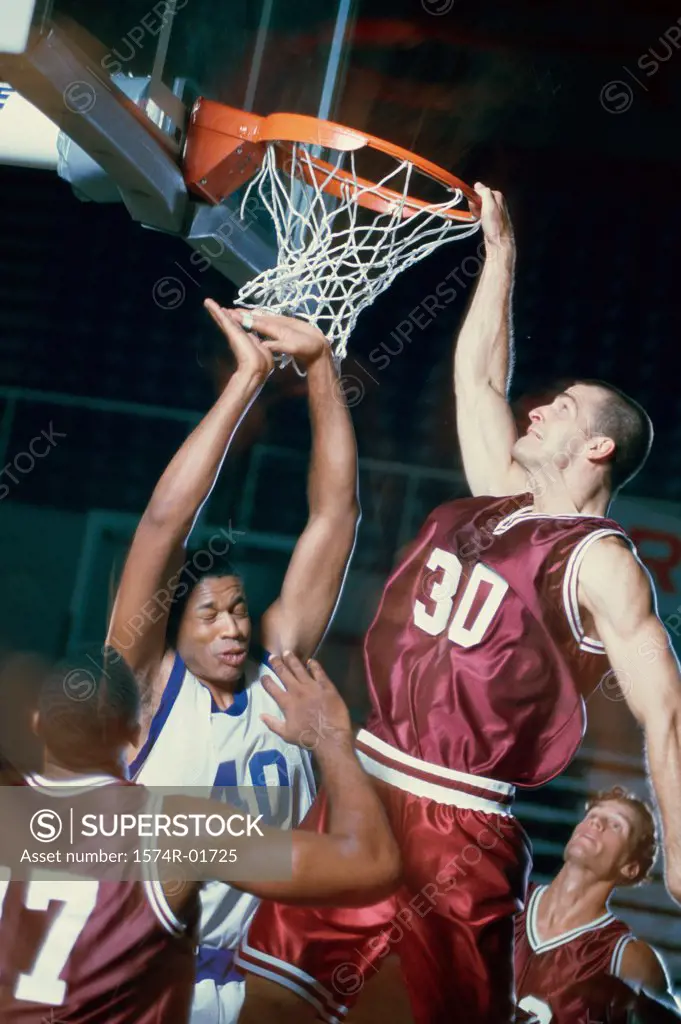Basketball player slam dunking a basketball