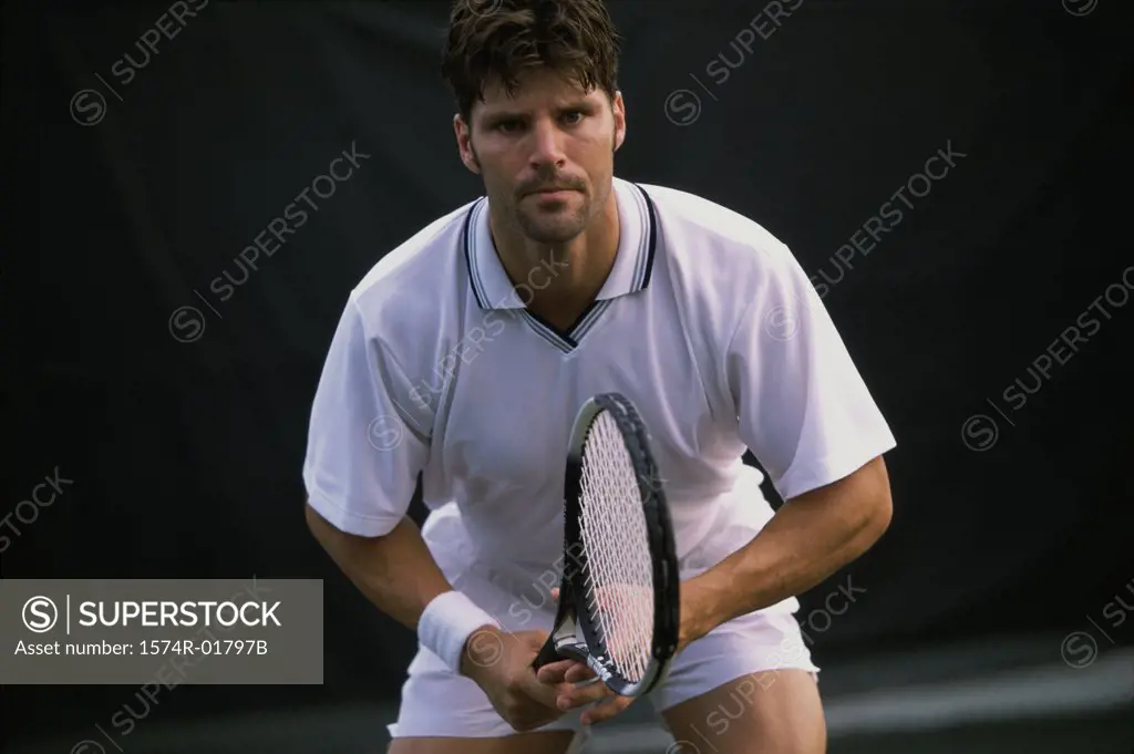 Portrait of a young man playing tennis