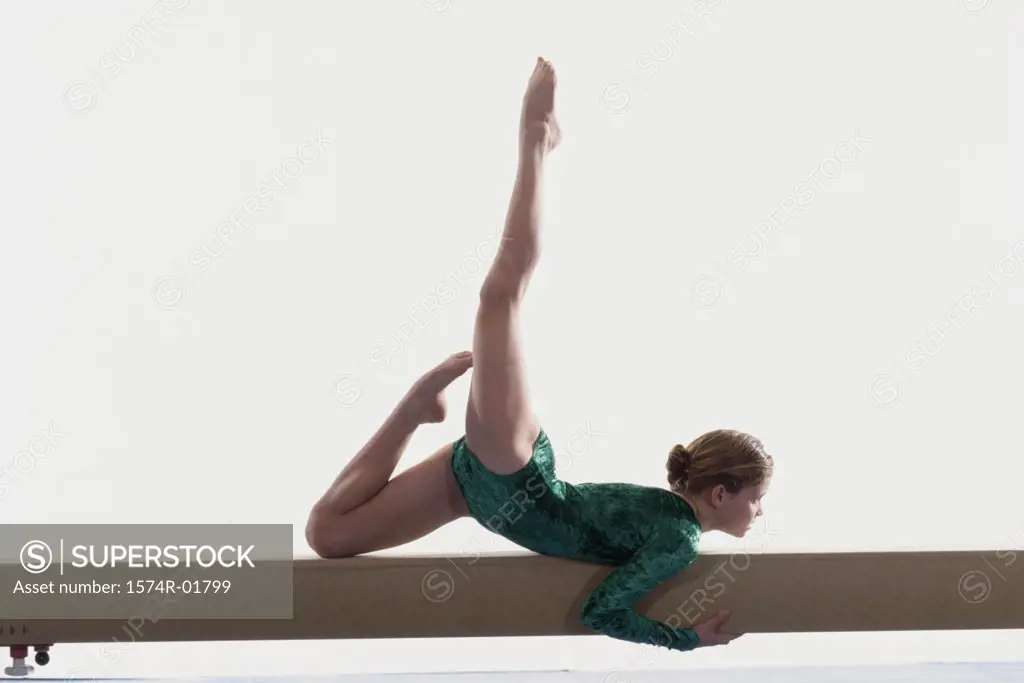 Teenage girl on a balance beam