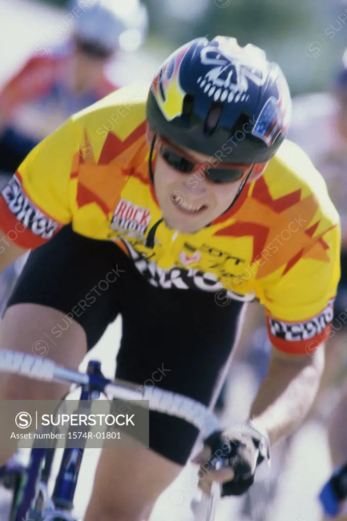 Young man cycling in a race