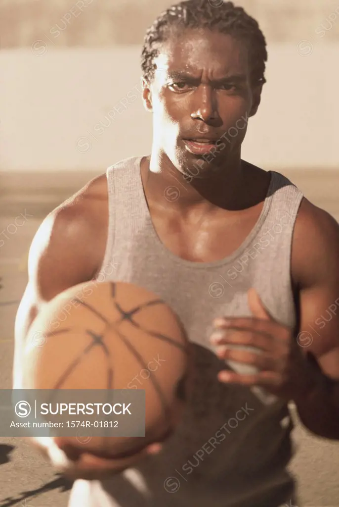 Portrait of a basketball player holding a ball