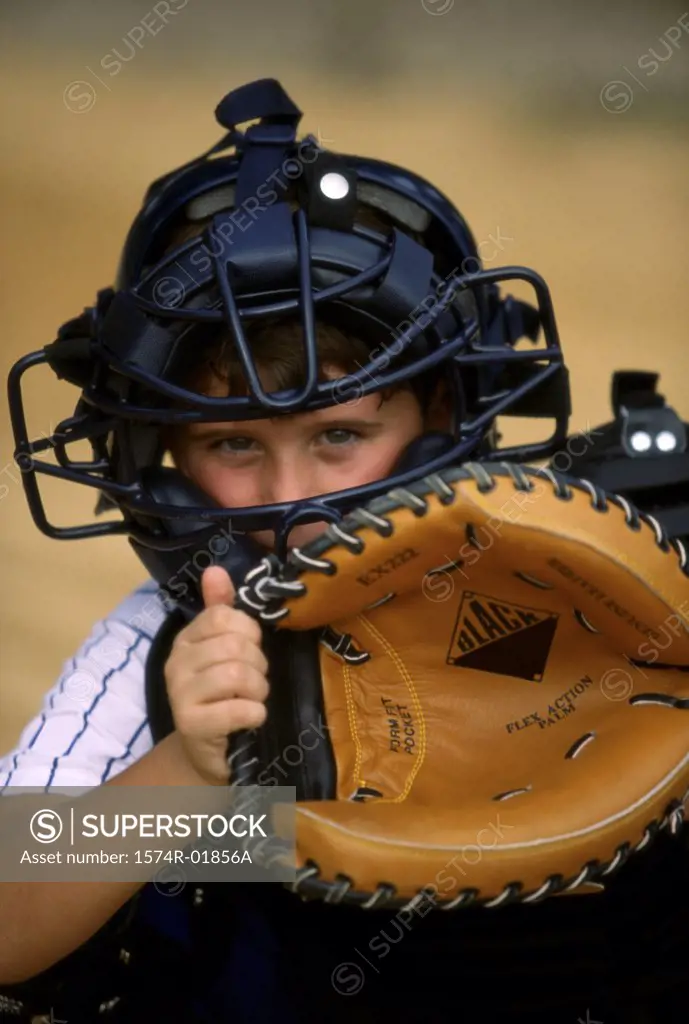 Portrait of a boy holding a baseball glove