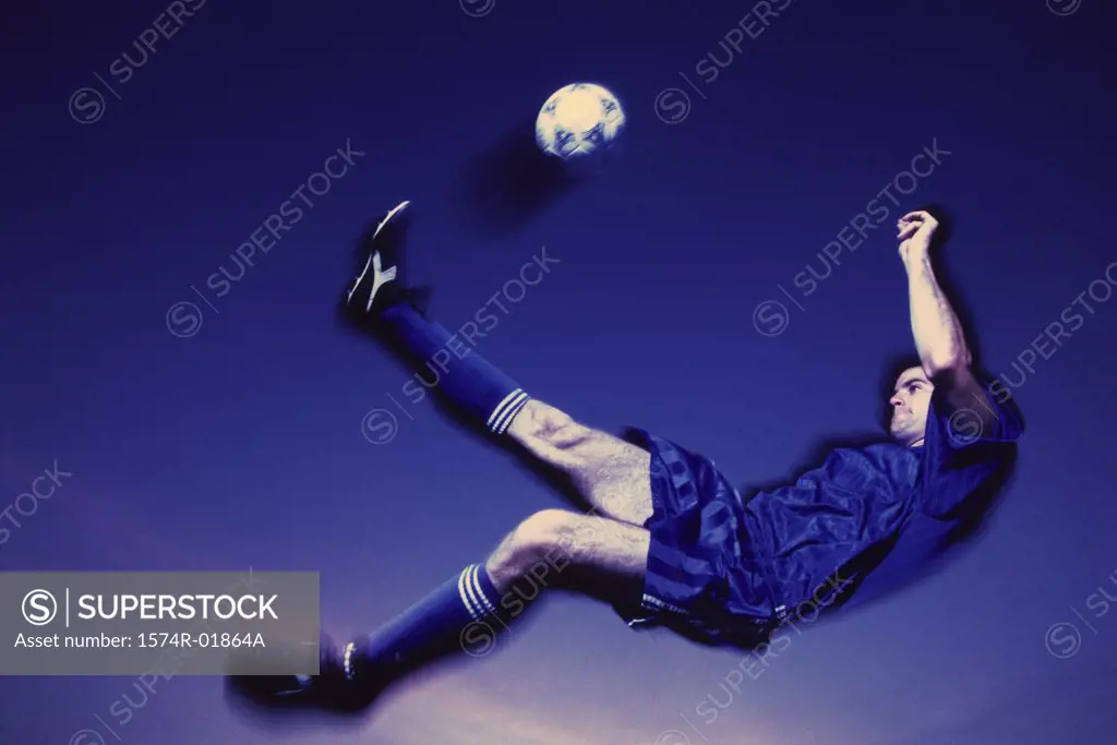 Soccer player kicking a ball