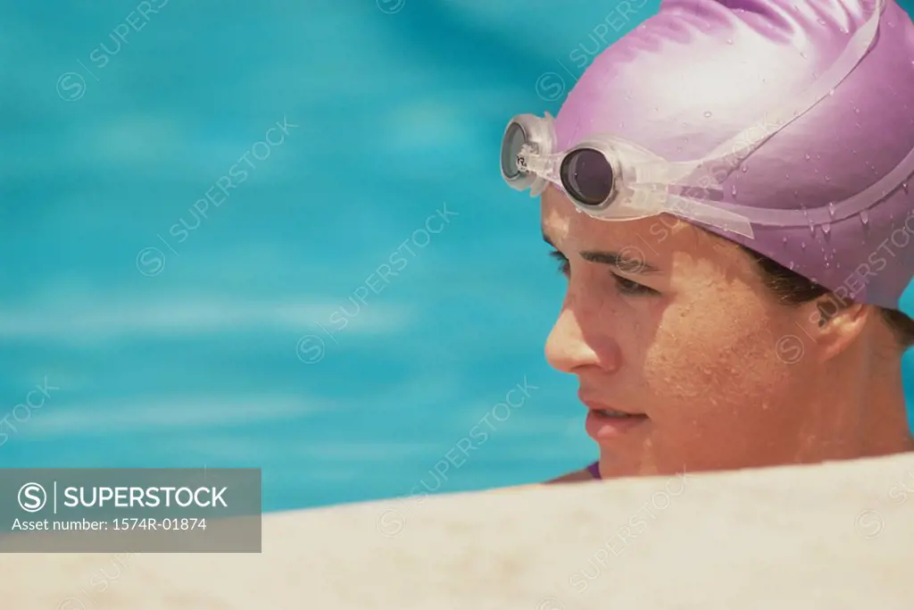 Young female swimmer in a swimming pool