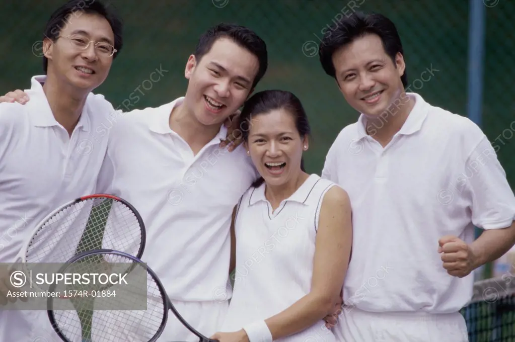 Portrait of a group of people at a tennis court