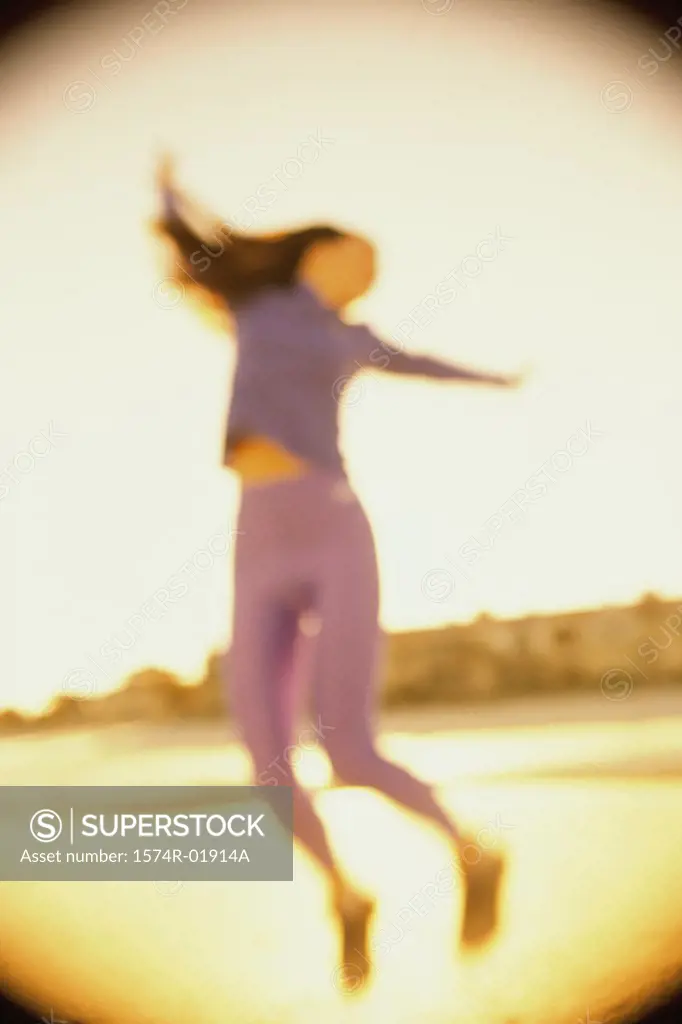 Low angle view of a young woman dancing