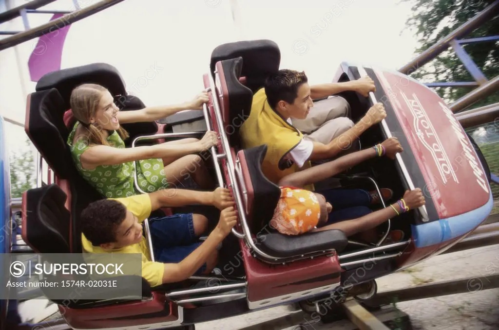Group of teenagers riding a rollercoaster