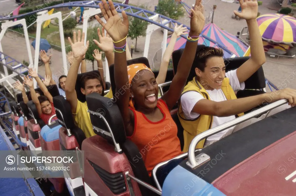 Group of teenagers riding a rollercoaster