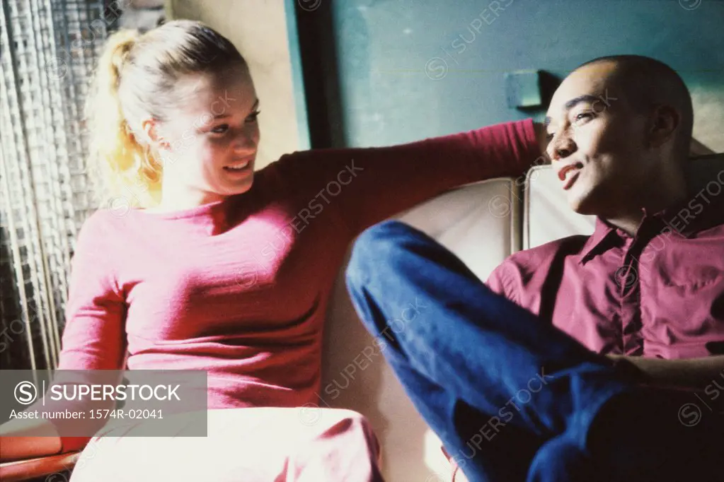 Young couple sitting on a couch