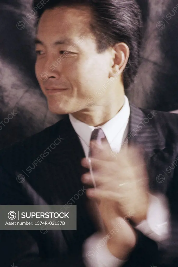 Close-up of a businessman clapping
