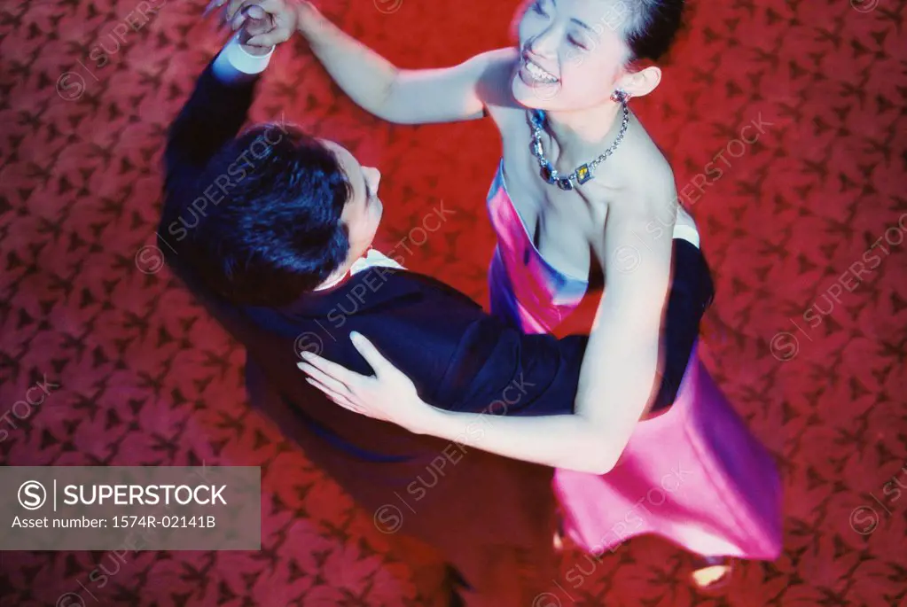 High angle view of a young couple dancing in a nightclub