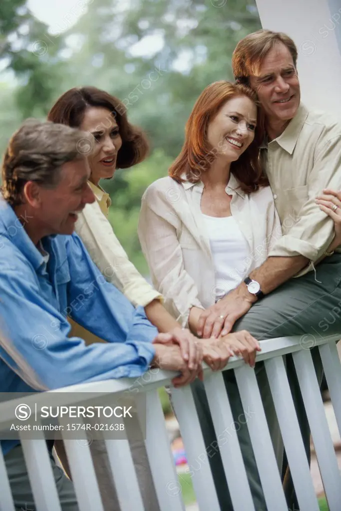 Two mid adult couples sitting together