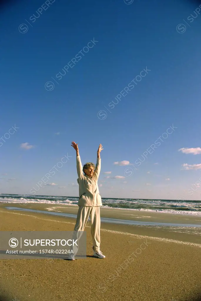 Senior woman exercising on the beach