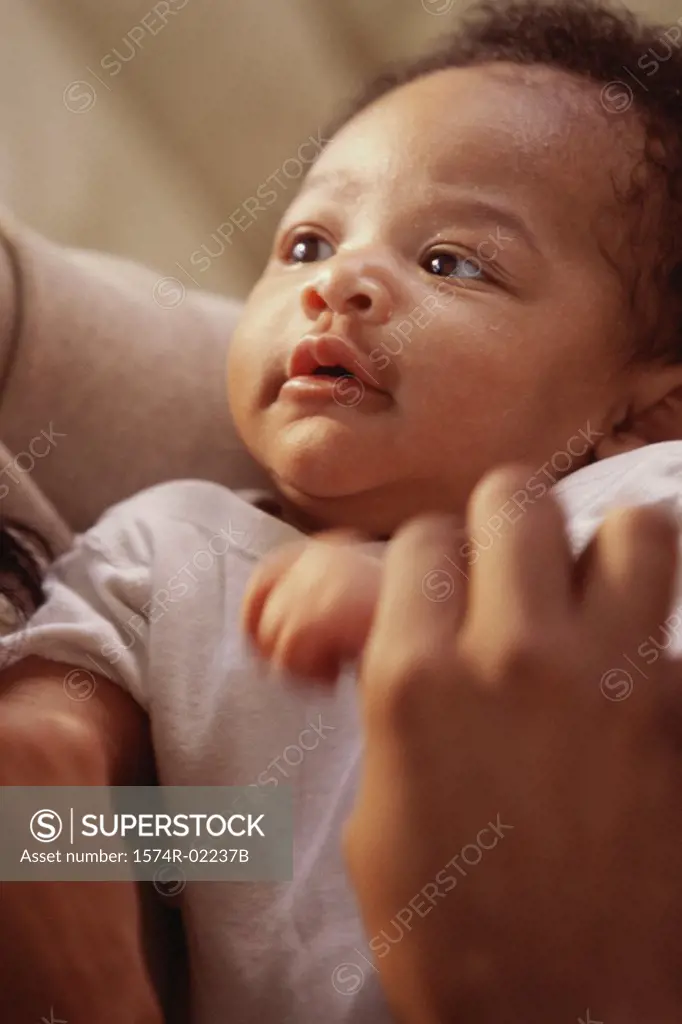 Person holding a baby boy