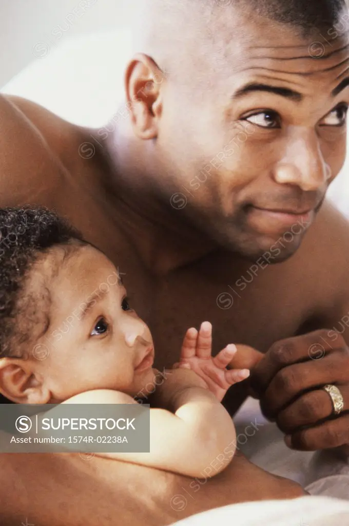 Close-up of a father holding his baby boy