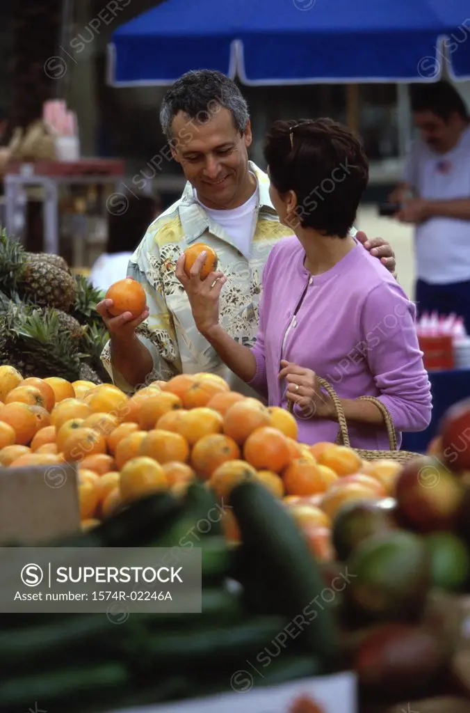 Mature couple shopping in the market