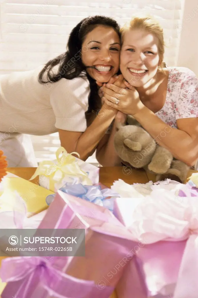 Portrait of two young women smiling at a baby shower