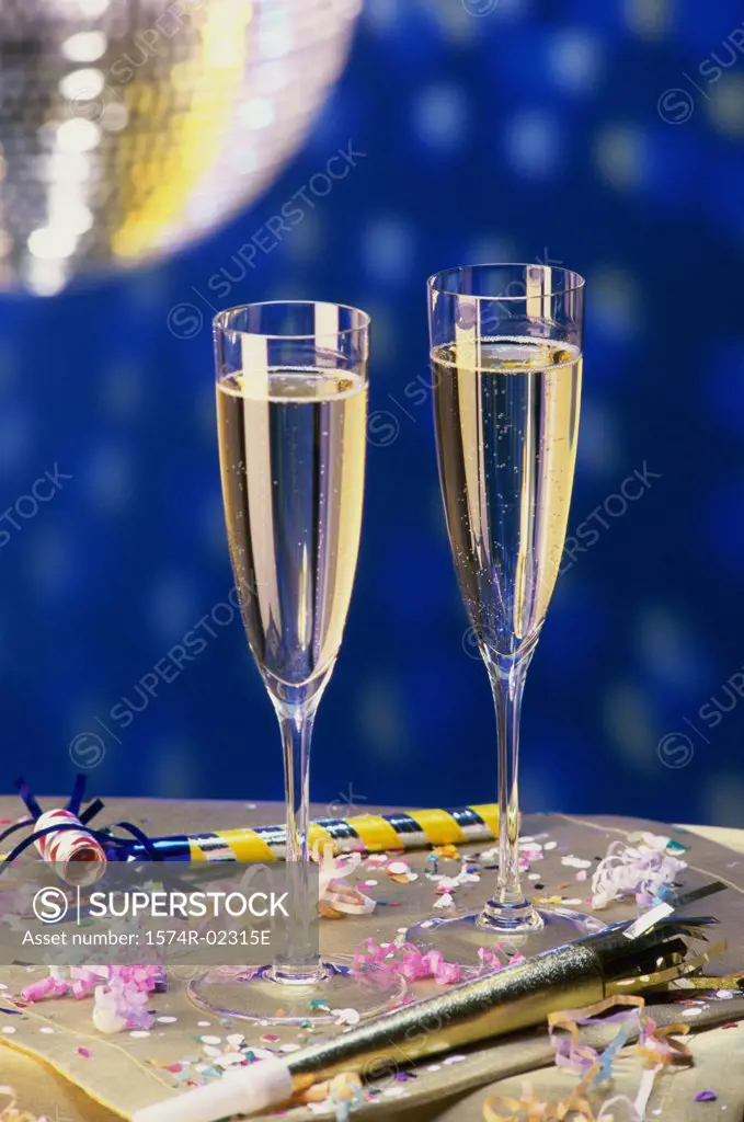 Close-up of two champagne flutes on a table