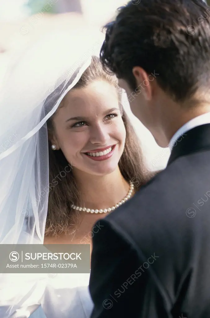 Close-up of a newlywed couple looking at each other