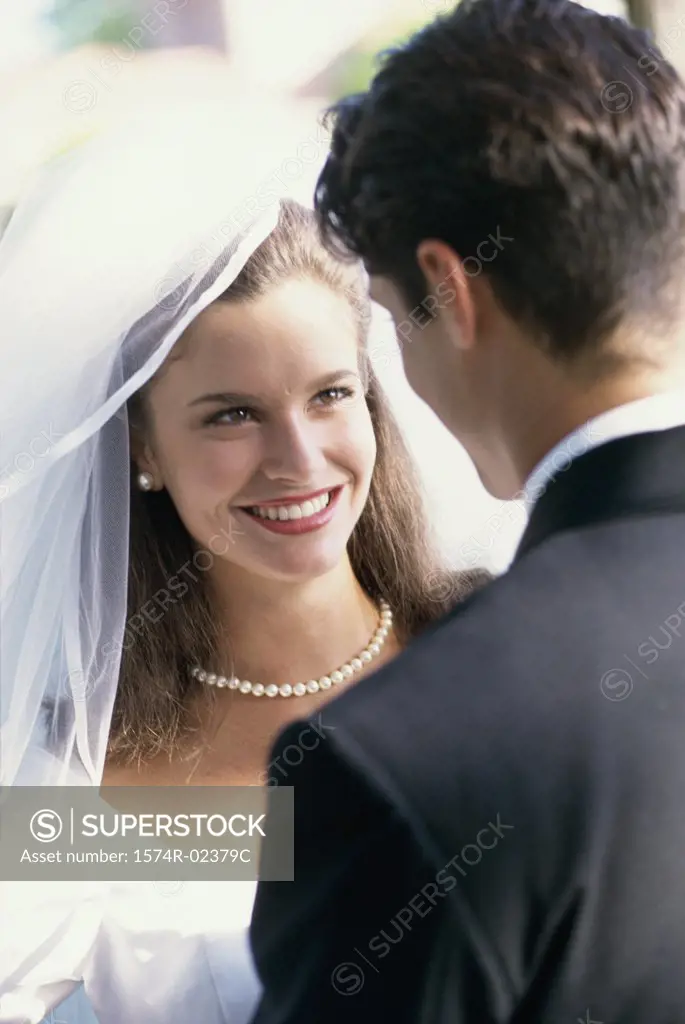Close-up of a newlywed couple looking at each other