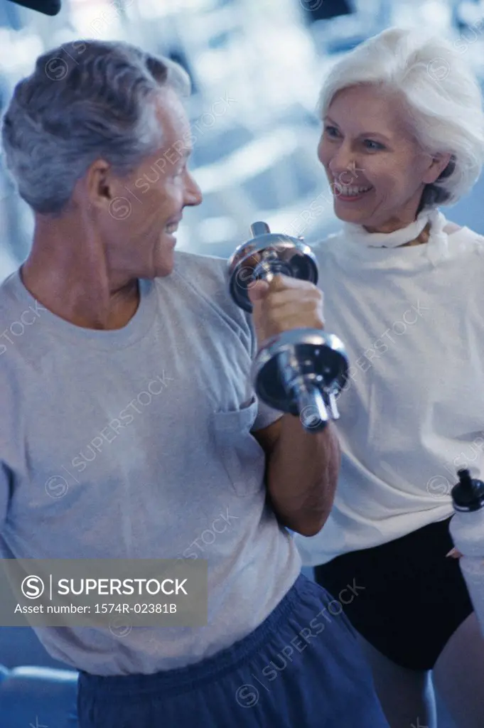 Senior couple exercising in a health club