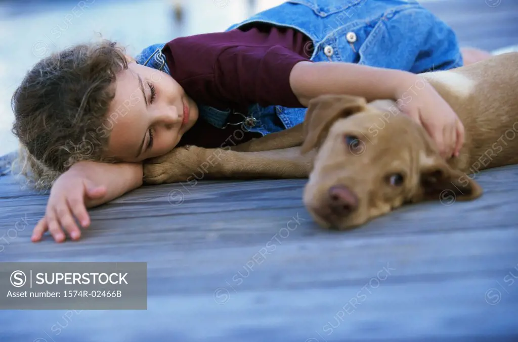 Girl lying down with her dog