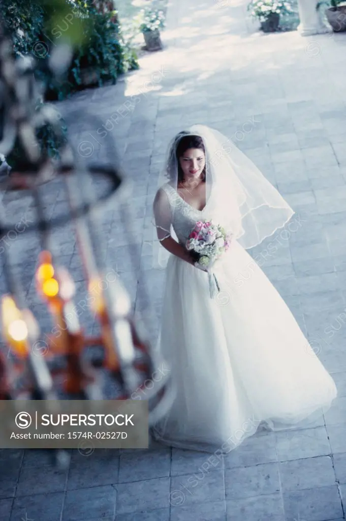 High angle view of a bride holding a bouquet of flowers