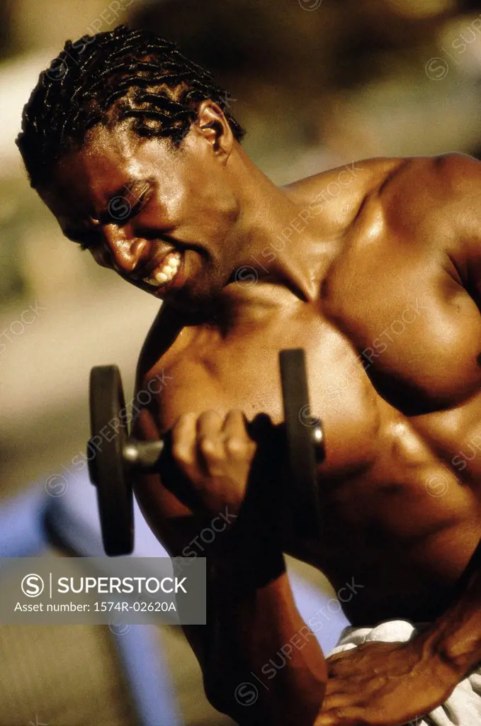 Young man exercising with a dumbbell