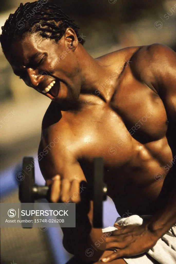 Young man exercising with a dumbbell