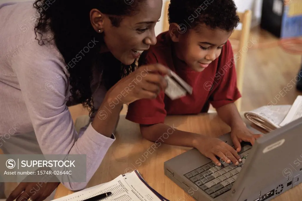 Mother and her son in front of a laptop