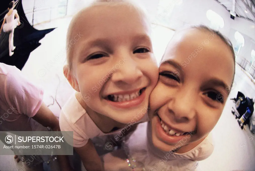 Close-up of two girls smiling