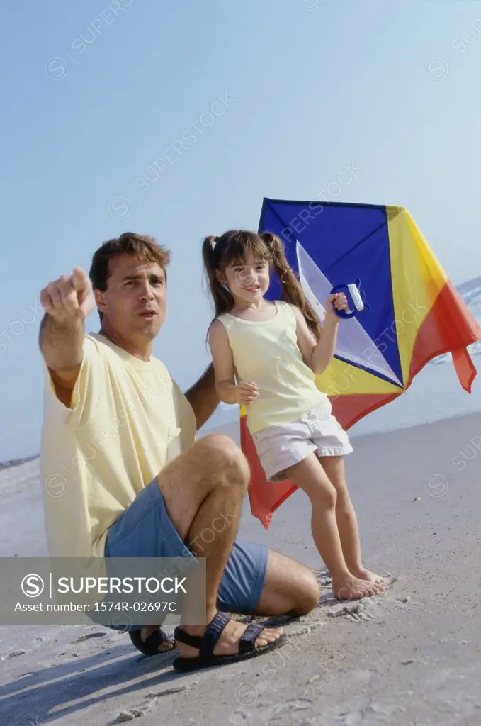 Father and his daughter on the beach