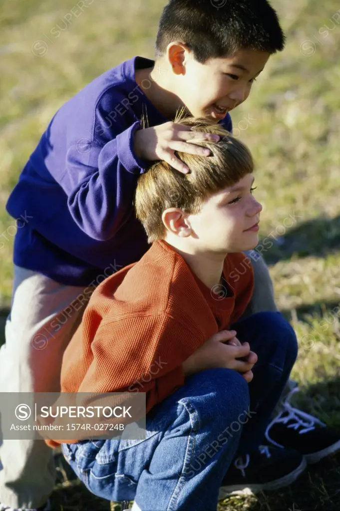 Side profile of two boys playing
