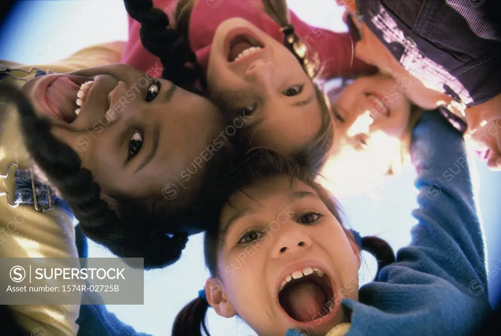 Close-up of a group of children in a huddle