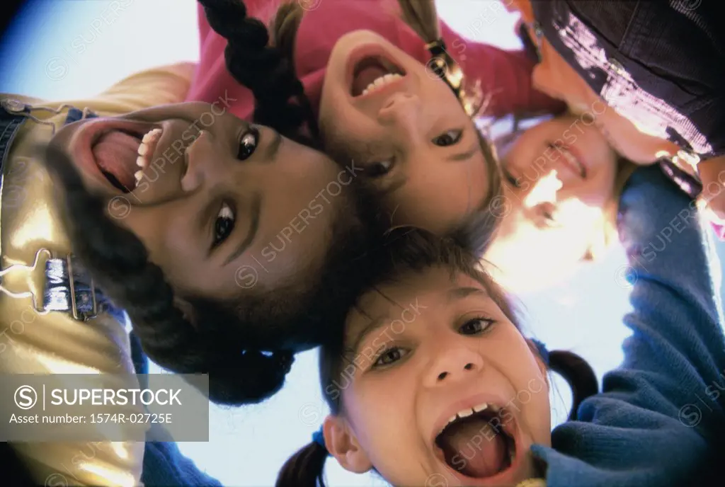 Close-up of a group of children in a huddle