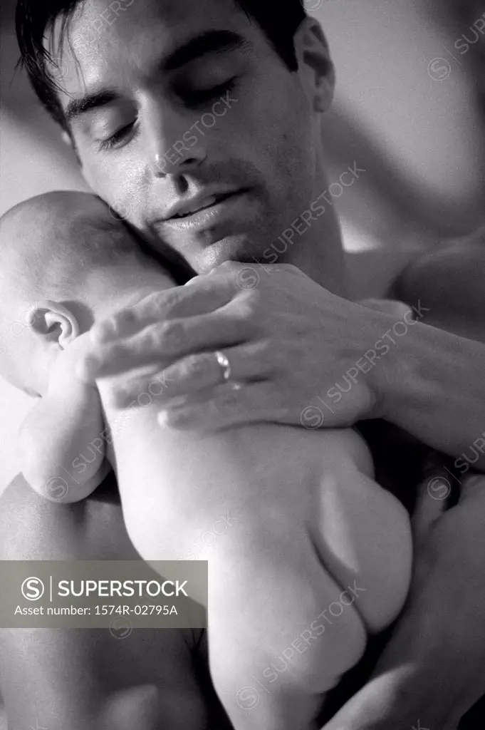 Close-up of a father carrying his baby boy