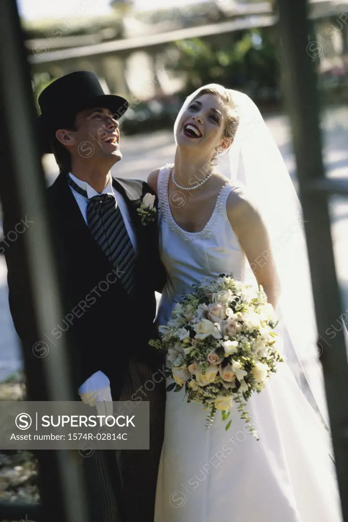 Newlywed couple laughing together