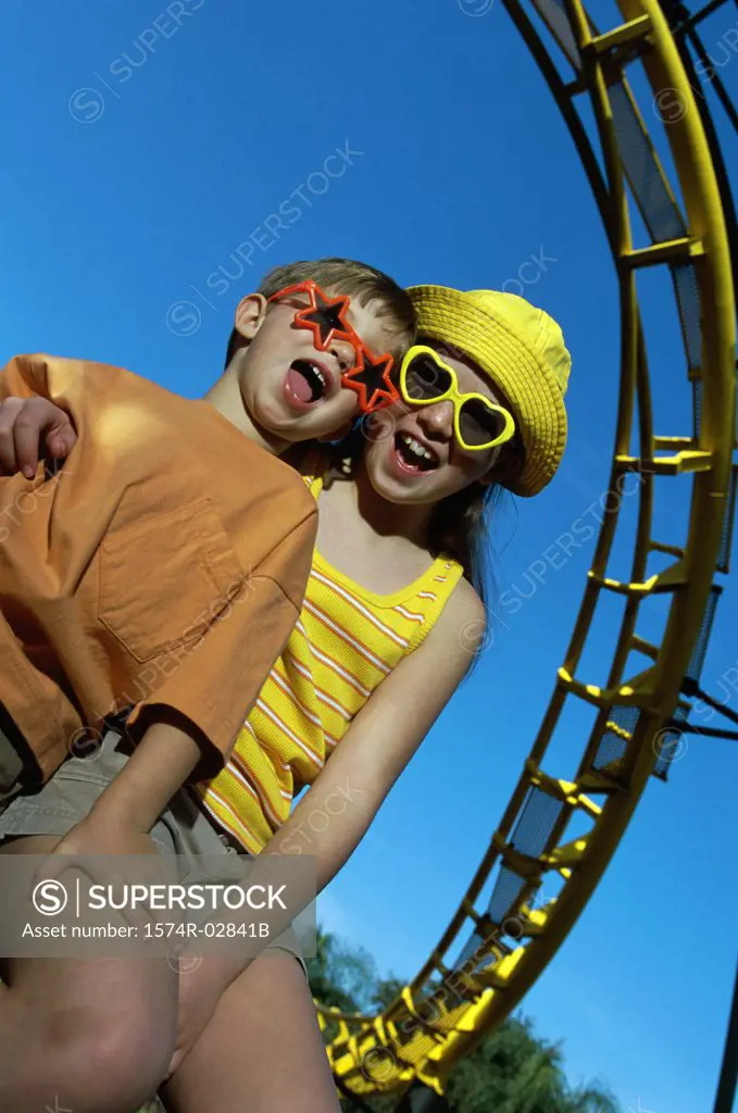 Portrait of a boy and a girl at an amusement park