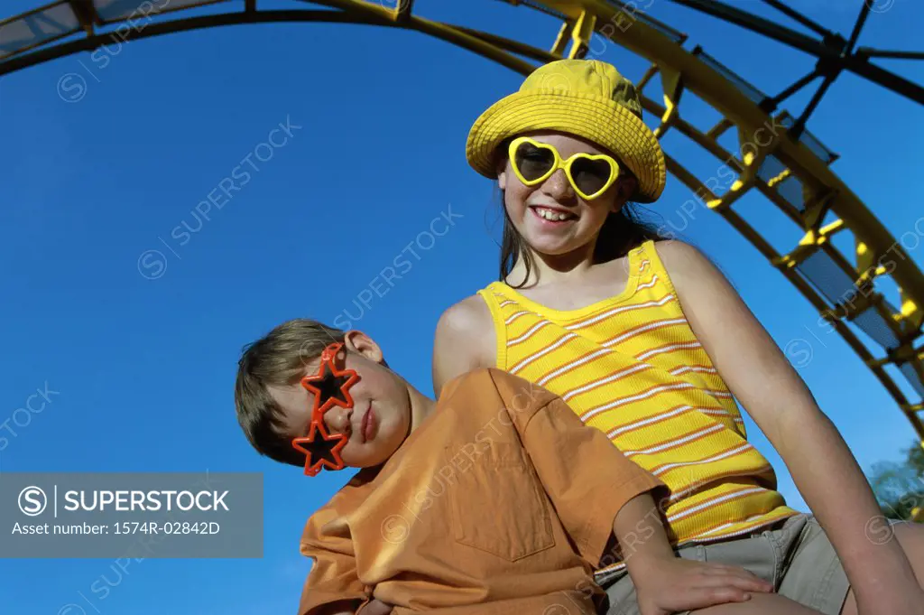 Portrait of a boy and a girl in an amusement park
