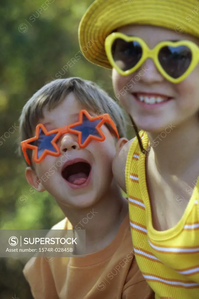 Portrait of a boy and a girl in an amusement park