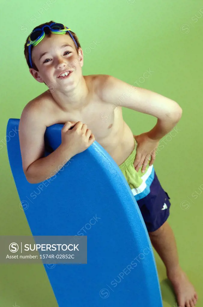 Portrait of a boy holding a boogie board