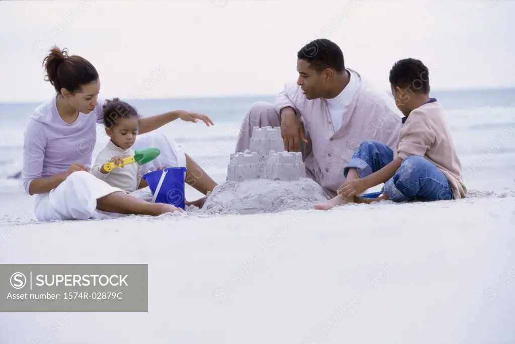 Parents with their son and daughter on the beach
