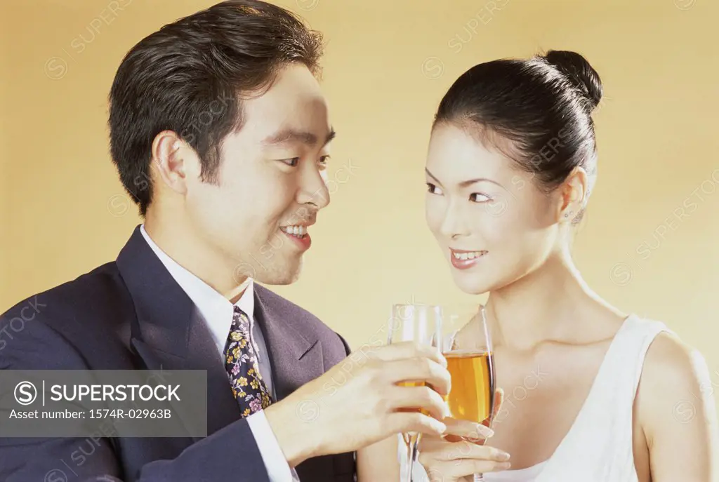 Close-up of a young couple toasting