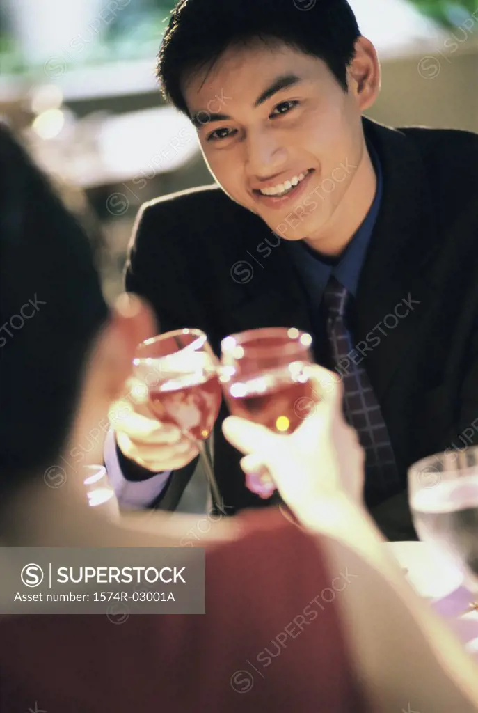 Young couple toasting with wineglasses