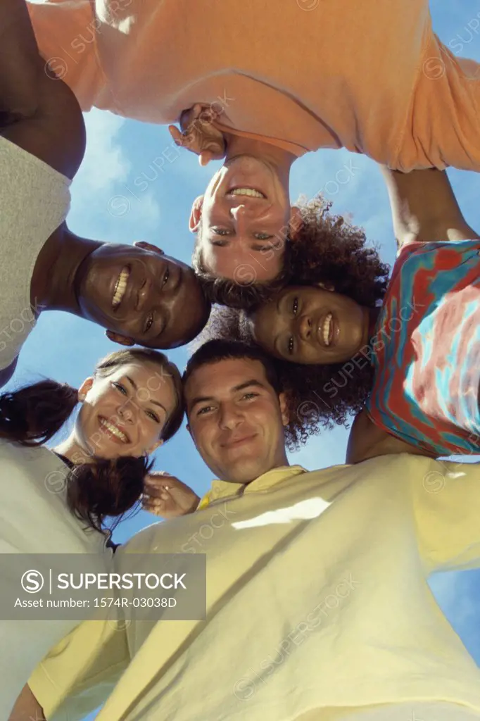Low angle view of a group of young people in a huddle