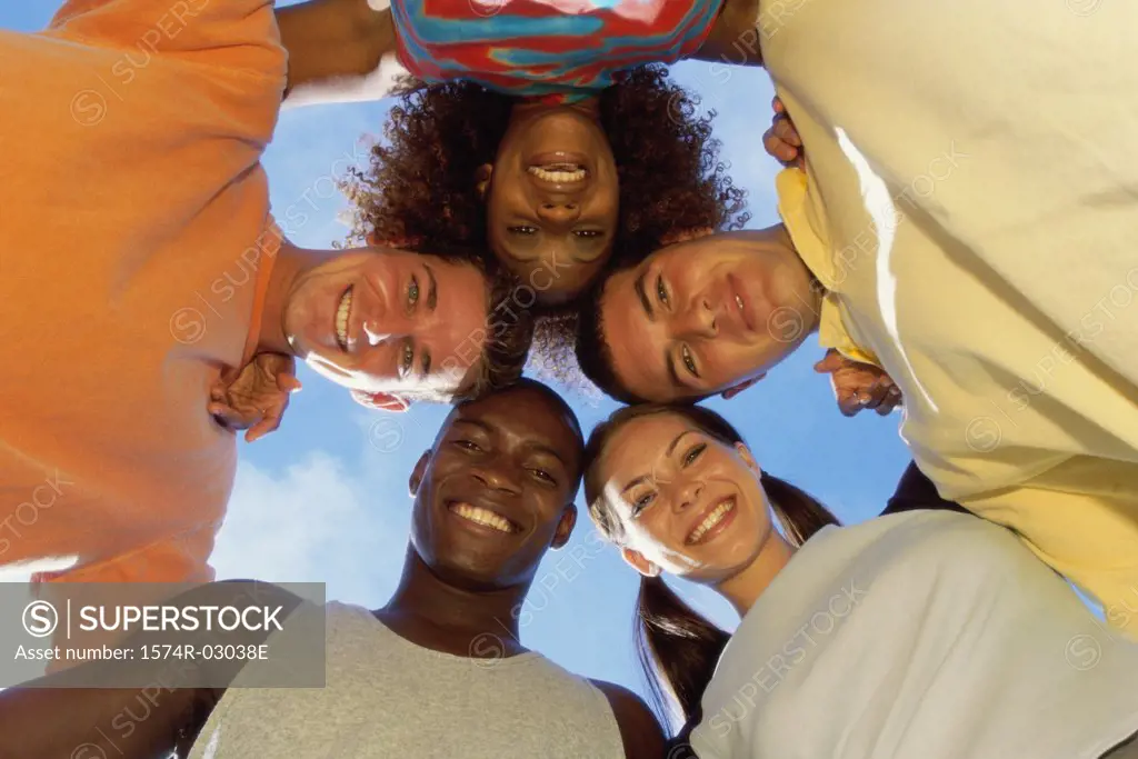 Low angle view of a group of young people in a huddle