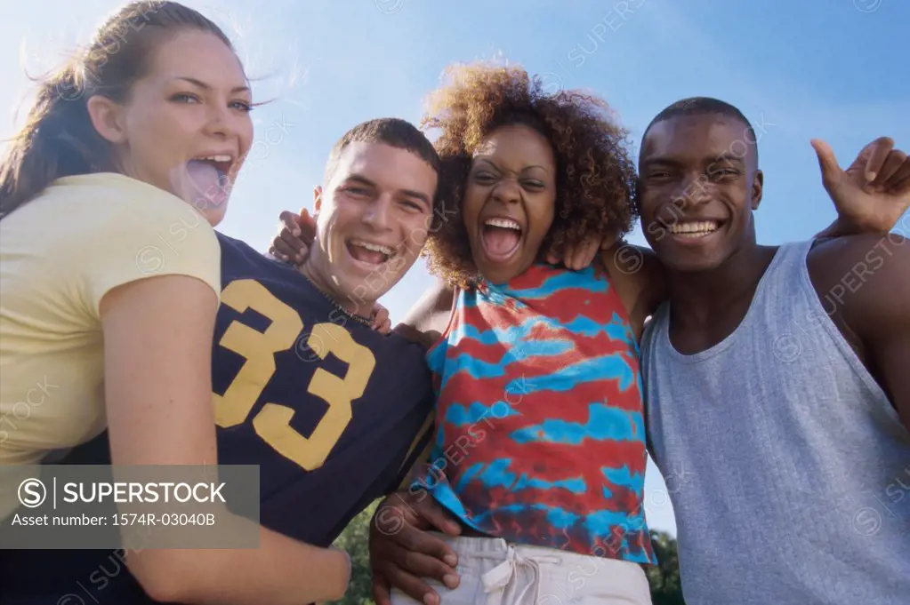 Portrait of two young couples smiling together