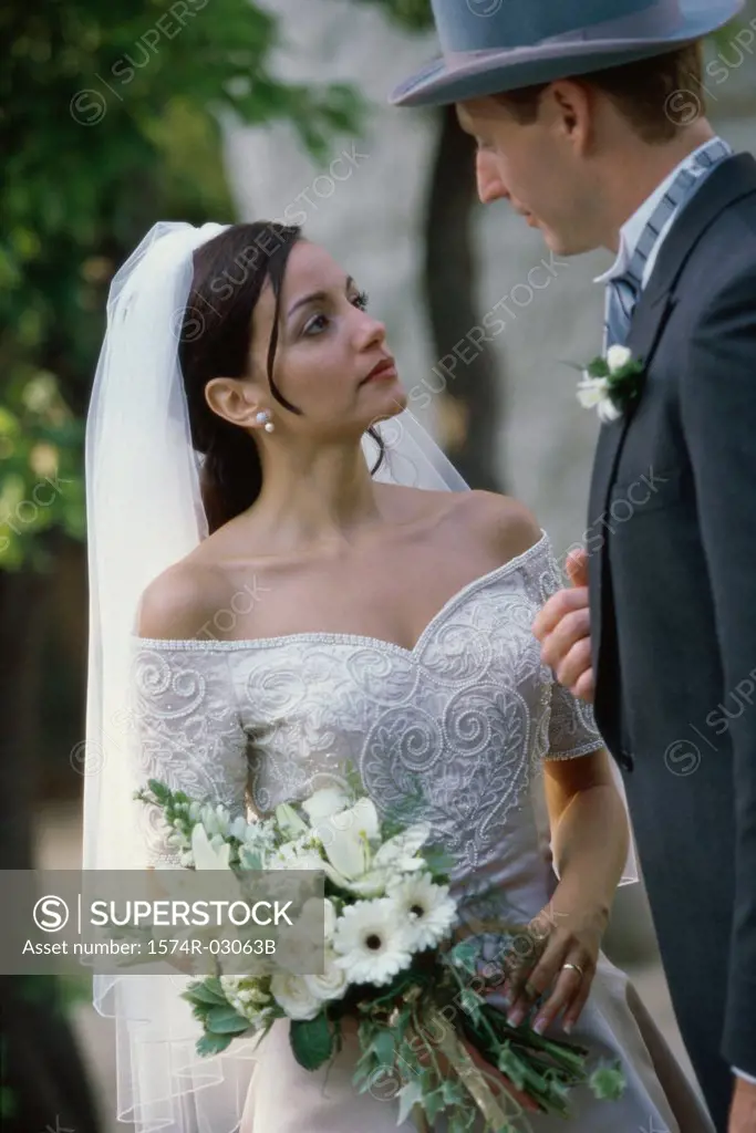 Close-up of a newlywed couple standing together