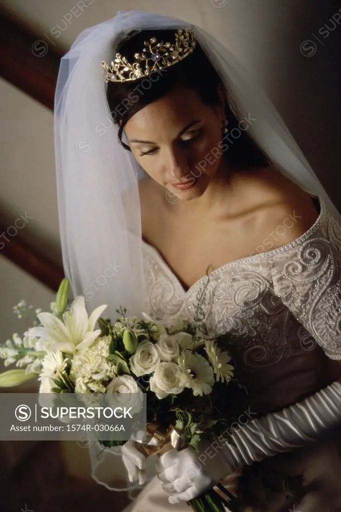 High angle view of a bride holding a bouquet of flowers